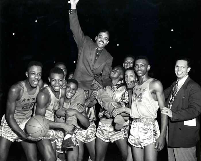 Crispus Attucks celebrates with coach Ray Crowe.